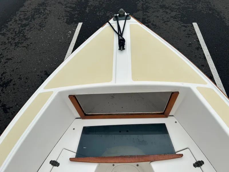 Slide: The Image of 2014 Nantucket Boat Works 17 Skiff, top view, parked on asphalt. - 14