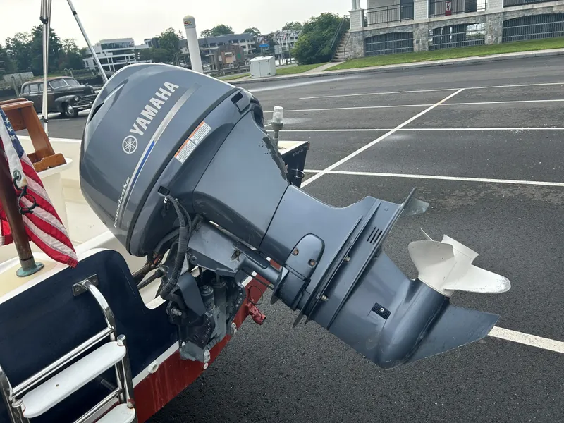 Slide: The Image of Yamaha outboard motor on 2014 Nantucket Boat Works 17 Skiff in parking lot. - 3
