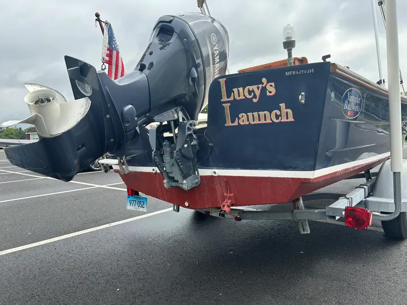 Slide: The Image of 2014 Nantucket Boat Works 17 Skiff, "Lucy's Launch," on trailer with Yamaha outboard motor. - 4