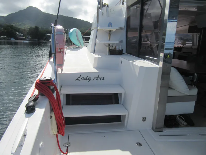Slide: The Image of Bali 4.1 yacht "Lady Ana" docked, featuring steps and scenic mountain backdrop. - 10