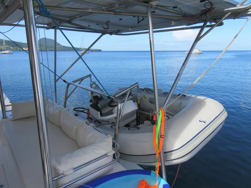 Slide: The Image of Catamaran Bali 4.1 with dinghy on calm sea, 2020 model. - 13