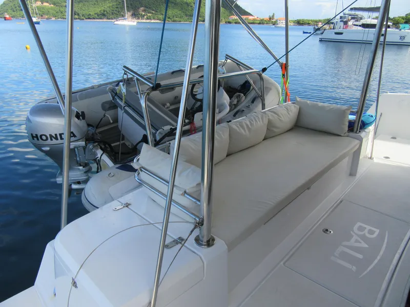 Slide: The Image of Luxury Bali 4.1 yacht with Honda motor, featuring comfortable seating and scenic water view. - 15