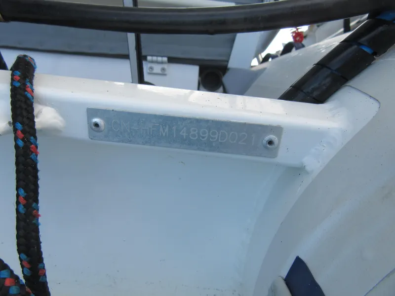 Slide: The Image of Hull identification number on a 2020 Bali 4.1 boat, featuring a metal plate. - 18