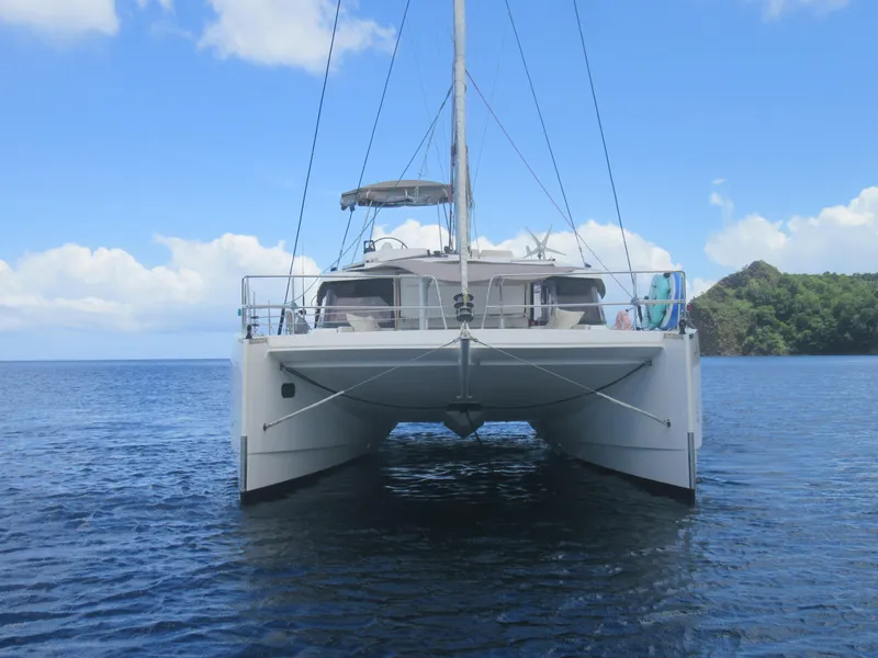 Slide: The Image of Front view of a 2020 Bali 4.1 catamaran on calm blue waters. - 2