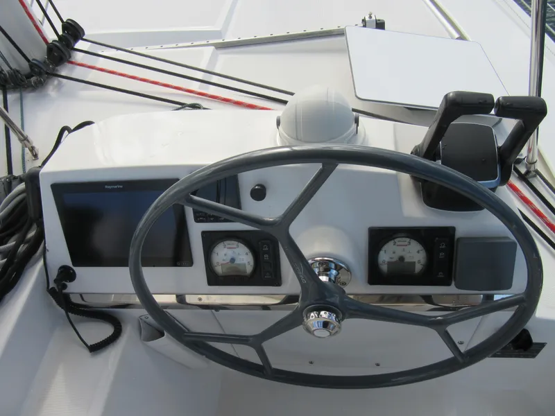 Slide: The Image of Steering wheel and controls of a 2020 Bali 4.1 yacht cockpit. - 24