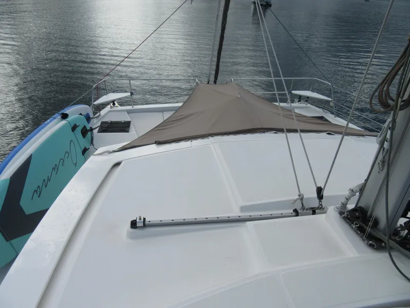 Slide: The Image of Deck view of a 2020 Bali 4.1 catamaran with paddleboard and canopy. - 29