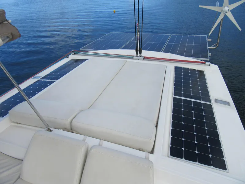 Slide: The Image of Catamaran Bali 4.1 (2020) with solar panels and wind turbine on deck. - 31