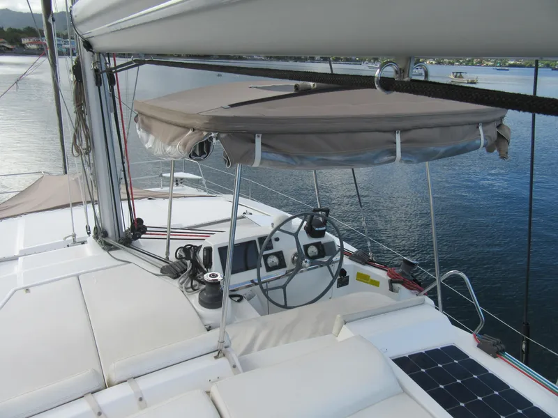 Slide: The Image of Sailing yacht Bali 4.1, 2020 model, featuring helm station and canopy on calm waters. - 34