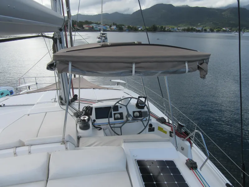 Slide: The Image of 2020 Bali 4.1 catamaran helm with canopy, docked in scenic harbor. - 35