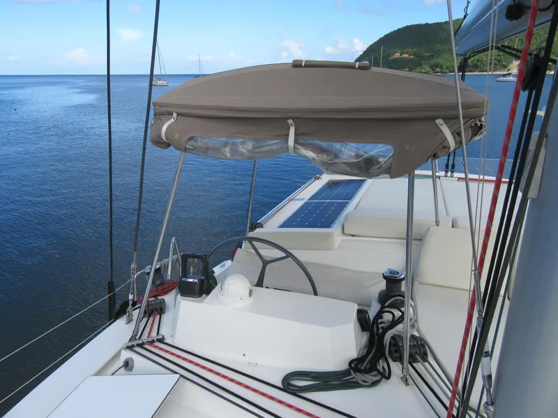 Slide: The Image of Bali 4.1 catamaran helm with canopy, solar panel, and ocean view, 2020 model. - 37