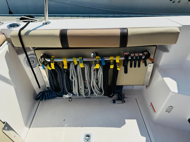 Slide: The Image of 2018 Ranger Tugs R-27 boat deck with organized ropes and accessories. - 32