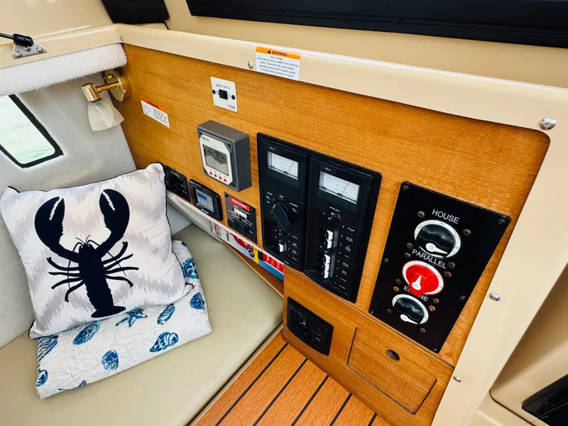 Slide: The Image of Control panel of 2018 Ranger Tugs R-27 with nautical-themed decor. - 36