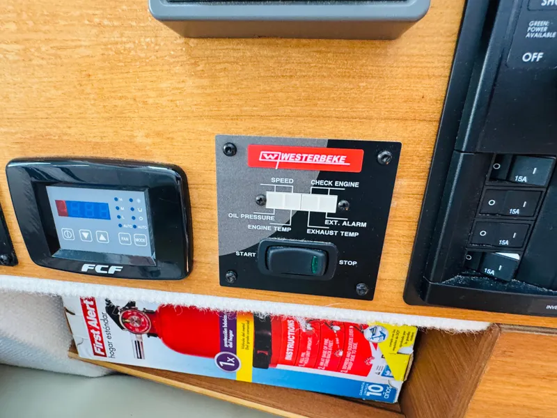 Slide: The Image of Control panel of a 2018 Ranger Tugs R-27 boat with Westerbeke engine controls. - 39