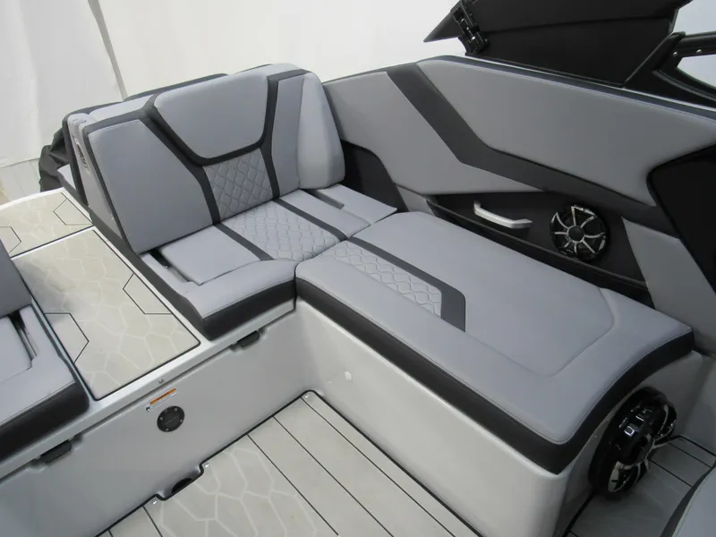 Slide: The Image of 2024 Yamaha Boats 255XD interior with sleek gray seating and modern design. - 10