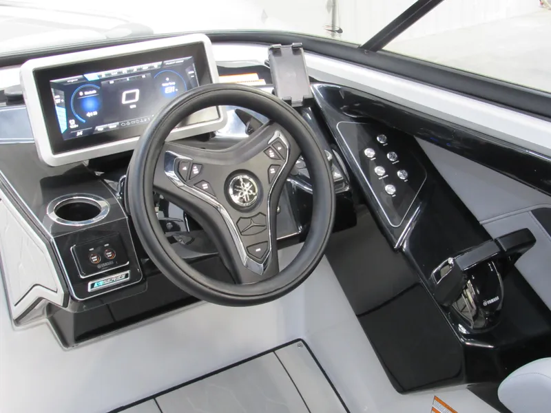 Slide: The Image of 2024 Yamaha Boats 255XD dashboard with steering wheel and digital display. - 13