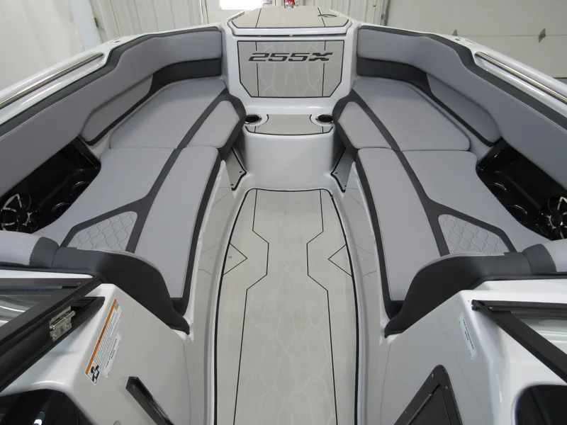 Slide: The Image of 2024 Yamaha Boats 255XD interior with sleek gray seating and modern design. - 6