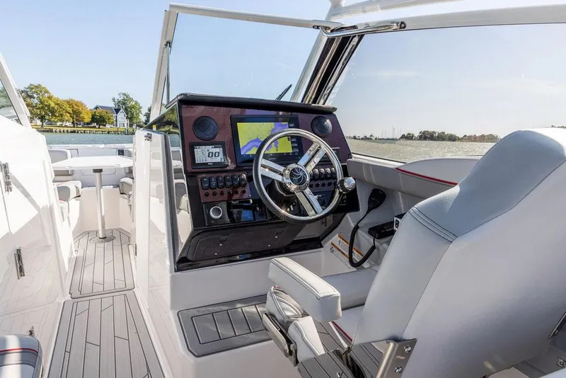 Slide: The Image of Manufacturer Provided Image: 2025 Solara S-250 DC boat cockpit with modern steering and navigation system. - 6
