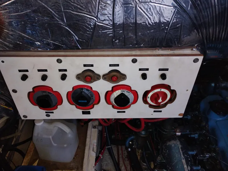 Slide: The Image of Control panel of a 1986 Bayliner 3870 Motoryacht engine room with switches and dials. - 28