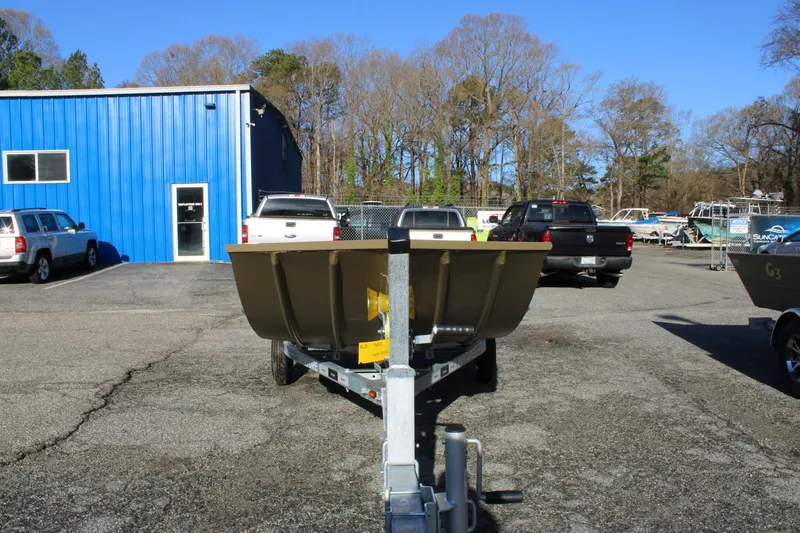 Slide: The Image of 2025 G3 Gator Tough 1652 VBW boat on trailer in parking lot. - 2