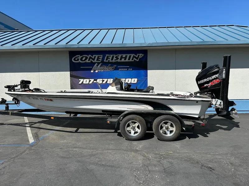 The Image of 1999 Fisher 21 FX DC boat on trailer, parked outside Gone Fishin' Marine. - 1
