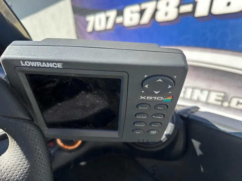 Slide: The Image of Lowrance X510 fish finder on a 1999 Fisher 21 FX DC boat dashboard. - 14