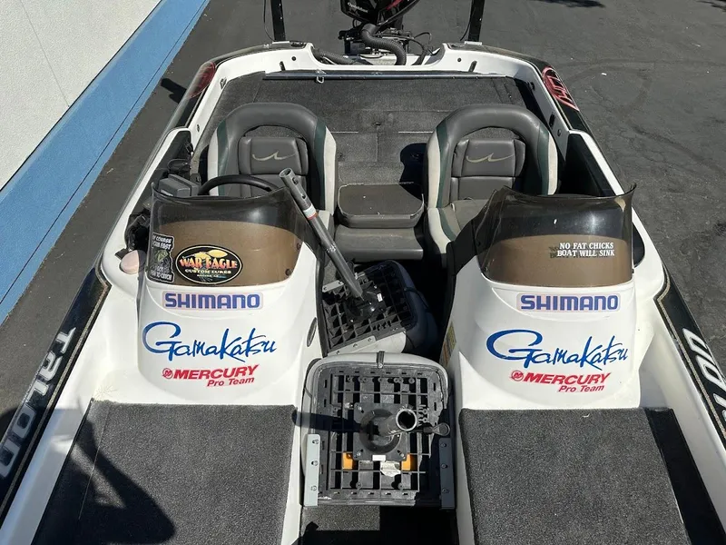 Slide: The Image of 1999 Fisher 21 FX DC boat interior with Shimano and Gamakatsu branding. - 18