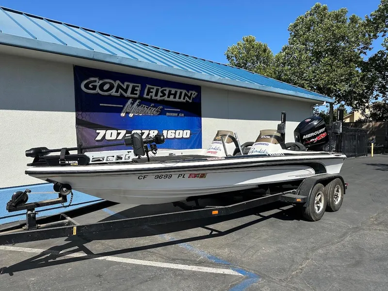 Slide: The Image of 1999 Fisher 21 FX DC boat on trailer at Gone Fishin' Marine dealership. - 2