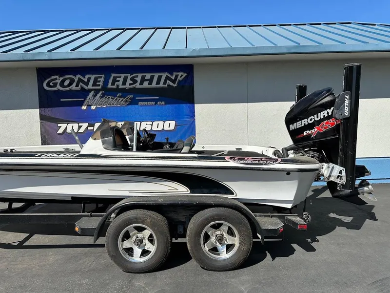 Slide: The Image of 1999 Fisher 21 FX DC boat with Mercury Pro XS engine on trailer. - 7