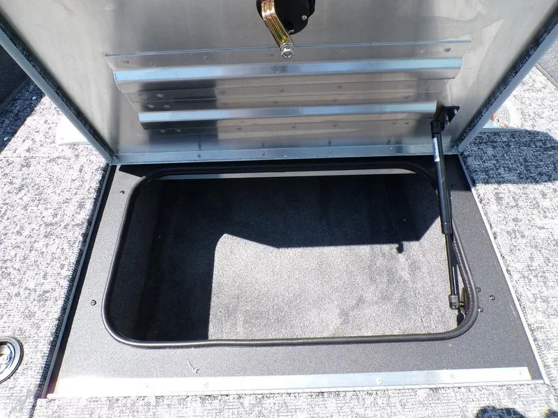 Slide: The Image of Open storage compartment on 2025 Tracker Pro Team 175 TF® boat. - 15