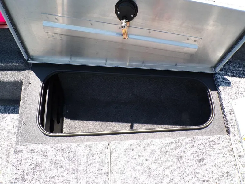 Slide: The Image of Open storage compartment on 2025 Tracker Pro Team 175 TF® boat. - 16