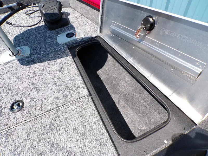 Slide: The Image of 2025 Tracker Pro Team 175 TF® boat storage compartment with textured flooring. - 17