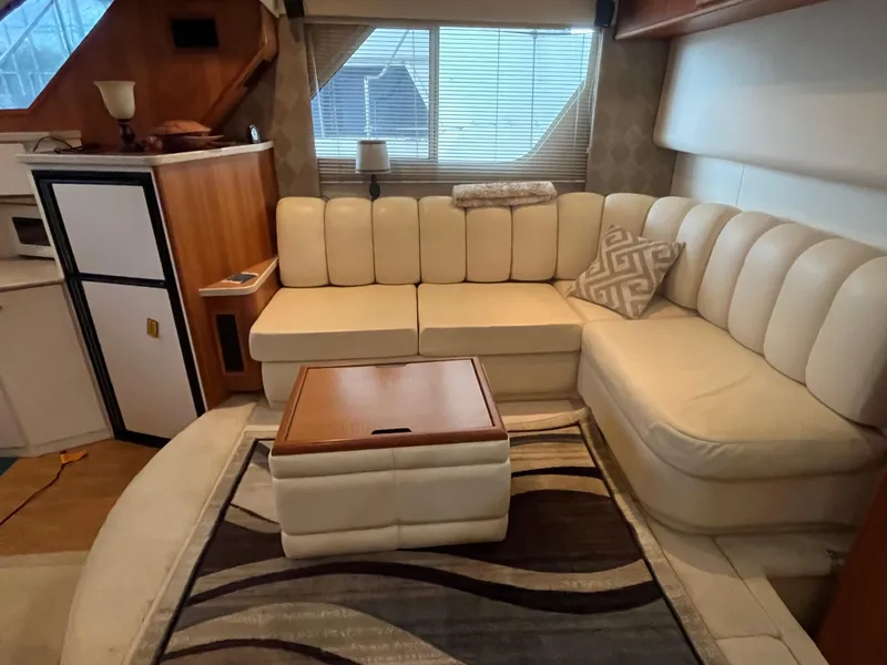 Slide: The Image of Luxurious interior of 1999 Silverton 392 Aft Cabin with cream leather seating and modern decor. - 24