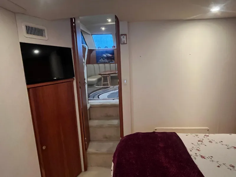 Slide: The Image of Interior of 1999 Silverton 392 Aft Cabin yacht, featuring cozy living space and modern amenities. - 31