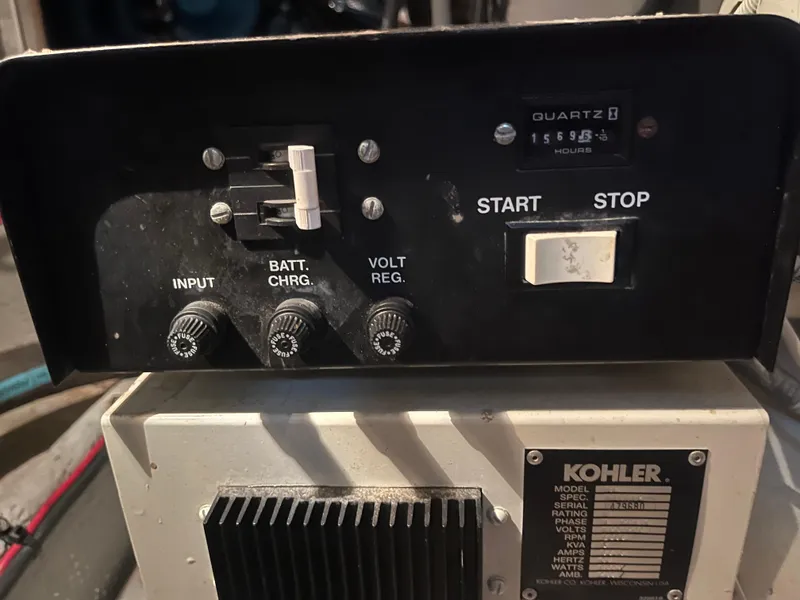 Slide: The Image of Control panel of a 1999 Silverton 392 Aft Cabin with Kohler generator. - 36