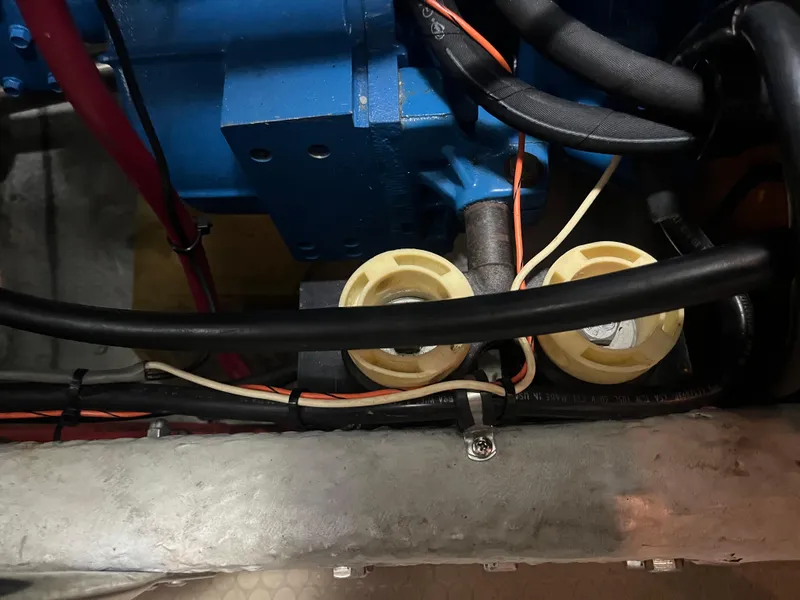 Slide: The Image of Engine compartment of a 1999 Silverton 392 Aft Cabin with visible wiring and components. - 37