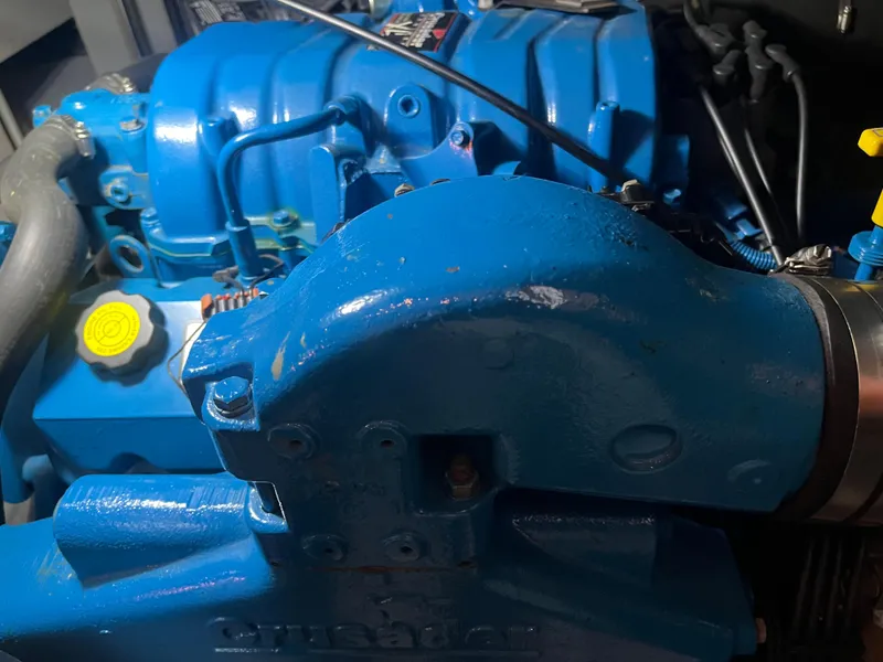 Slide: The Image of Close-up of a blue engine component in a 1999 Silverton 392 Aft Cabin boat. - 38