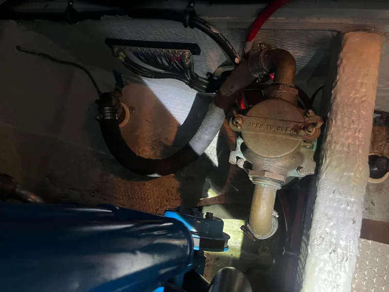 Slide: The Image of Engine compartment of a 1999 Silverton 392 Aft Cabin boat, showing mechanical components. - 41