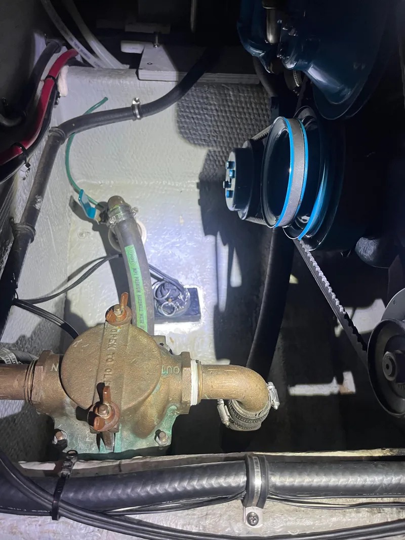 Slide: The Image of Engine compartment of a 1999 Silverton 392 Aft Cabin boat, showing mechanical components. - 42