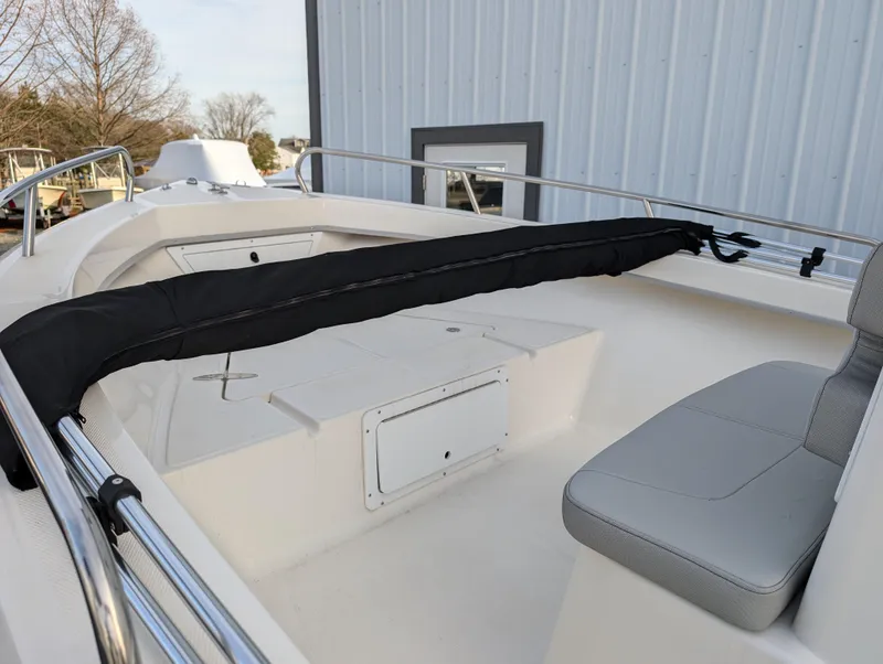 Slide: The Image of 2024 May-Craft 1900CC boat interior with seating and storage compartments. - 11