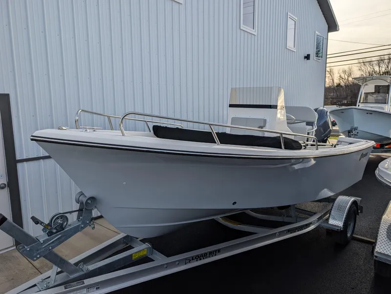 Slide: The Image of 2024 May-Craft 1900CC boat on trailer, parked beside a building. - 4