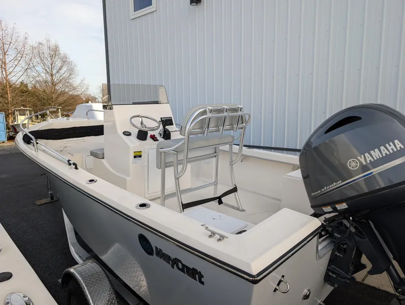 Slide: The Image of 2024 May-Craft 1900CC boat with Yamaha outboard motor, parked near a building. - 5