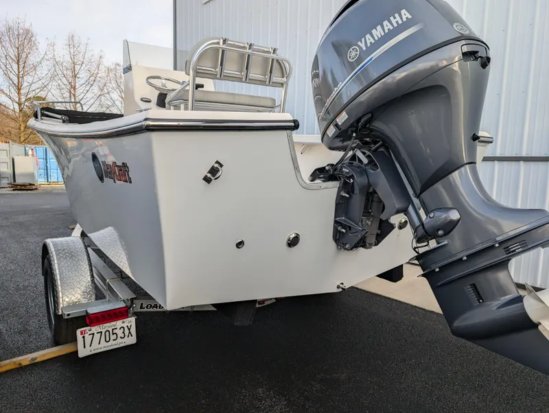 Slide: The Image of 2024 May-Craft 1900CC boat with Yamaha outboard motor, parked on trailer. - 6