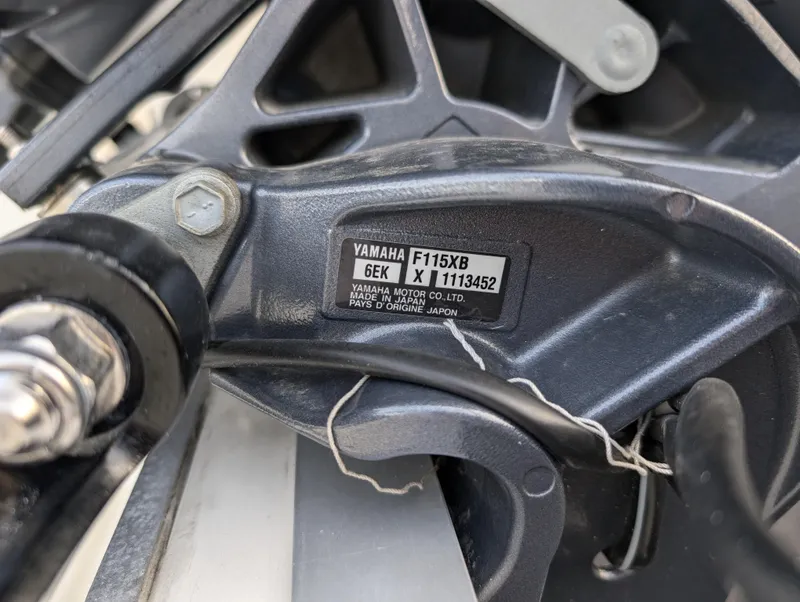 Slide: The Image of Close-up of Yamaha F115XB engine part on 2024 May-Craft 1900CC boat. - 7