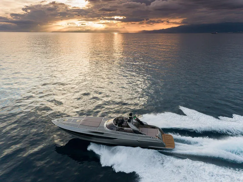 Slide: The Image of 2024 Rizzardi GR SESSANTATRE yacht cruising at sunset on open water. - 1