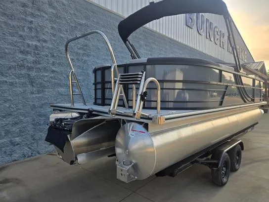 Slide: The Image of 2026 South Bay S224RS pontoon boat on trailer, parked outdoors. - 10