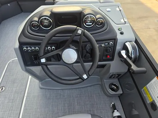 Slide: The Image of 2026 South Bay S224RS boat dashboard with steering wheel and control panel. - 7