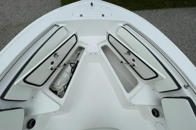 Slide: The Image of 2024 Tidewater 198 CC Adventure boat interior with open storage compartments. - 10