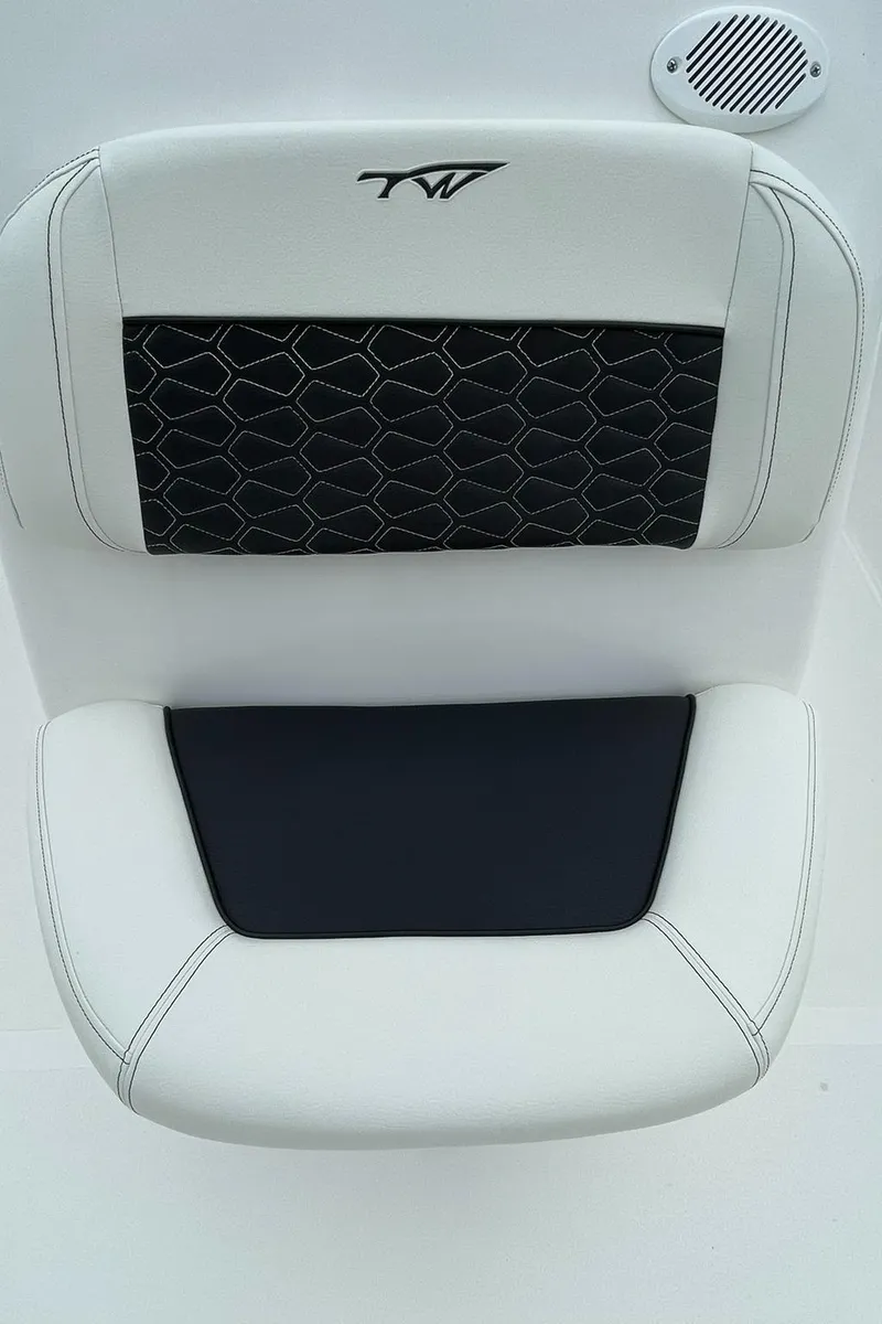 Slide: The Image of 2024 Tidewater 198 CC Adventure boat seat with black and white upholstery design. - 13