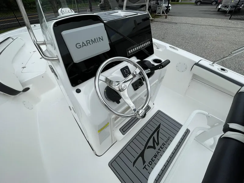 Slide: The Image of 2024 Tidewater 198 CC Adventure boat dashboard with Garmin navigation system. - 18