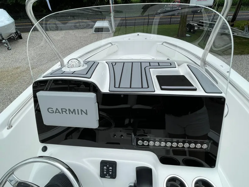 Slide: The Image of 2024 Tidewater 198 CC Adventure boat dashboard with Garmin navigation system. - 21